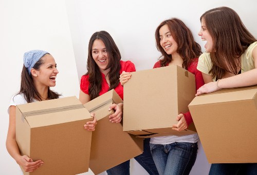 Team organising workplace equipment for a Stepney office move