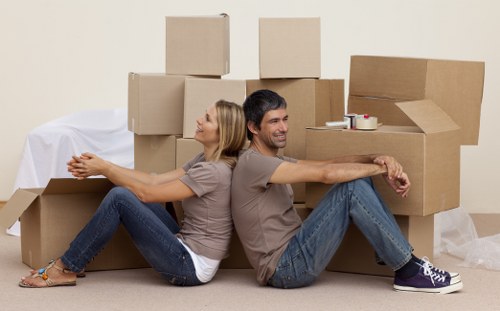 Unpacking support in a Stepney apartment after relocation