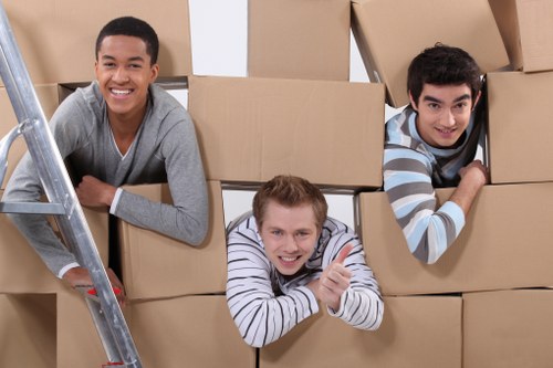 Professional removal team loading items in East London