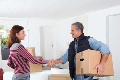 Professional movers loading household items for a Stepney relocation