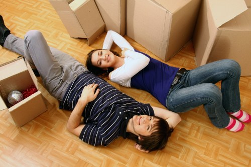 Driver loading boxes and household items into a van