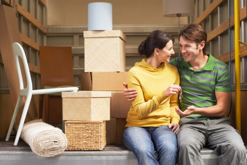 Packed boxes and furniture prepared for a home move in Stepney